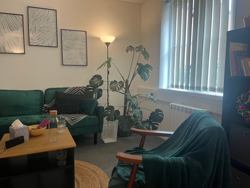 Picture of therapy room with sofa and arm chair
