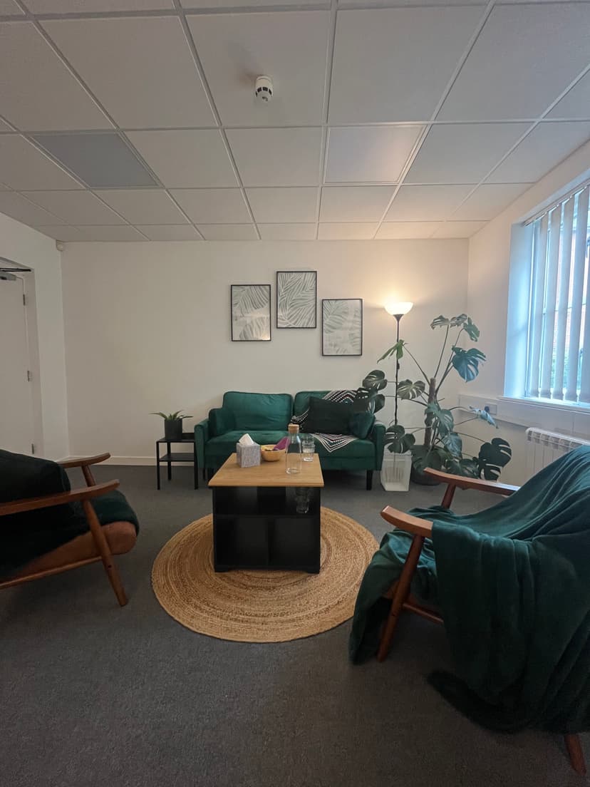 Picture of therapy room with sofa and arm chair